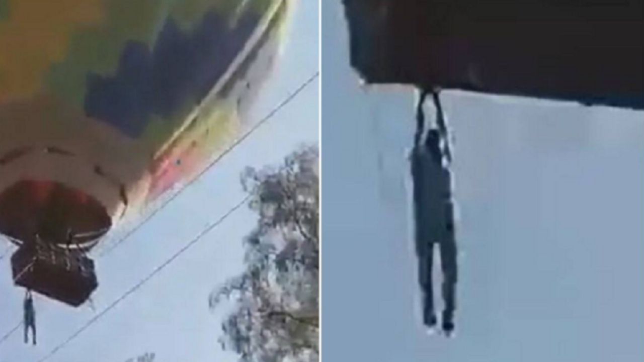 Homem se pendura em corda para não cair de balão no México