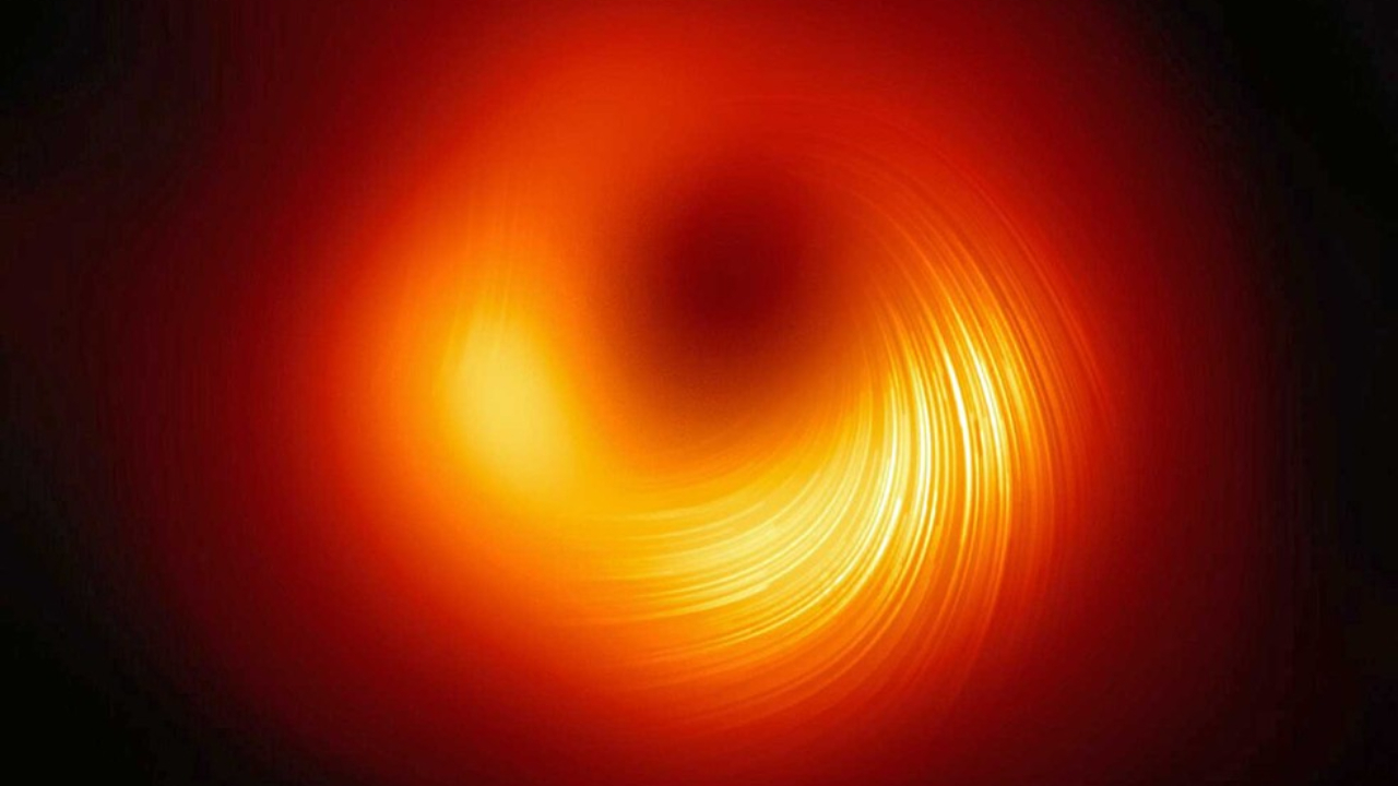 Pela primeira vez, cientistas fotografam o campo magnético de um buraco negro
