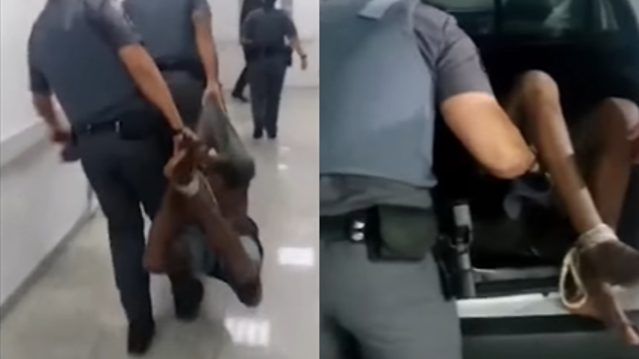Homem negro tem mãos e pés amarrados e é carregado por PMs em SP